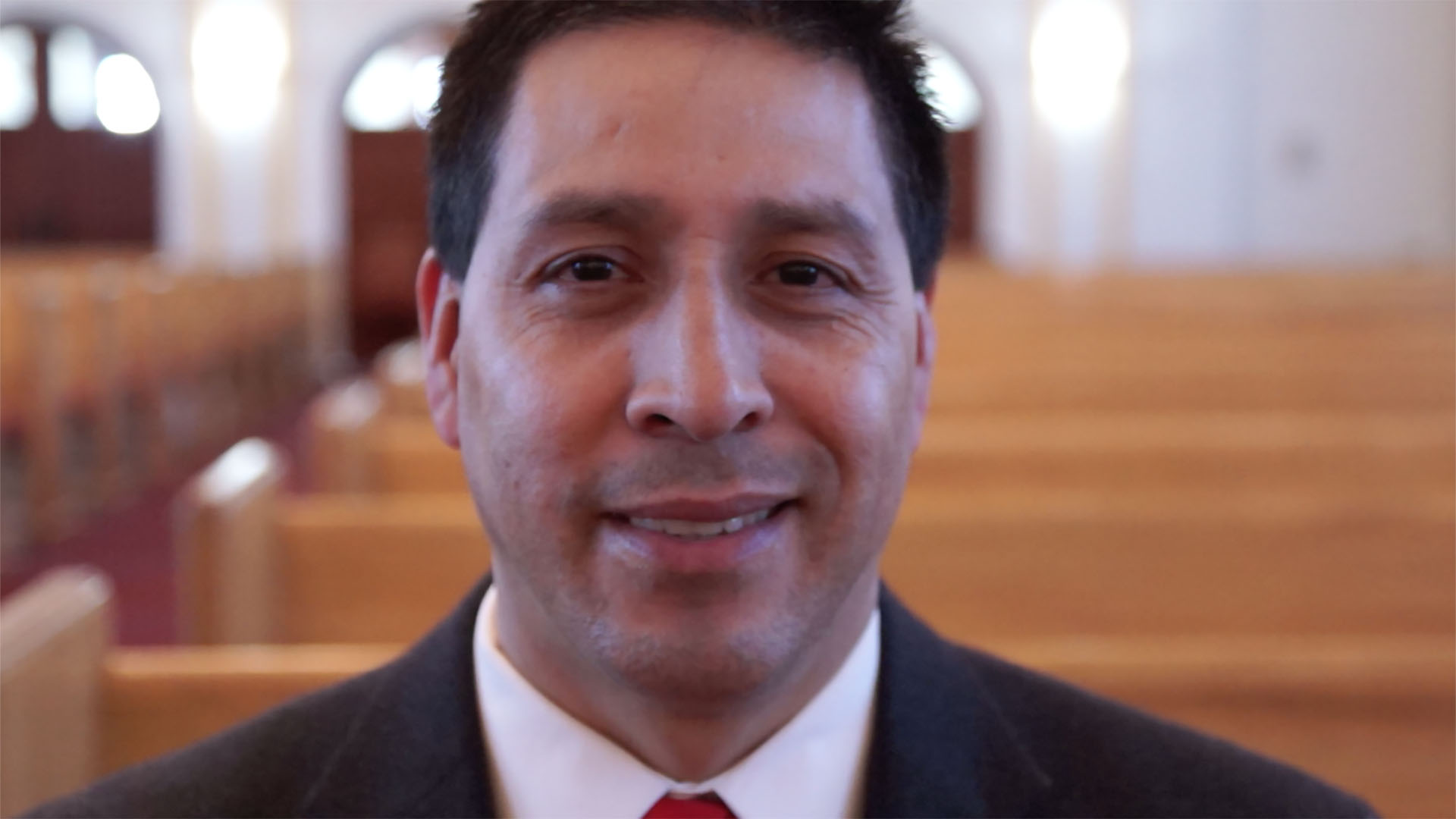 man looking into camera smiling