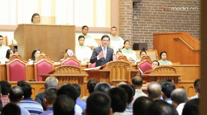 minister preaching during a worship service