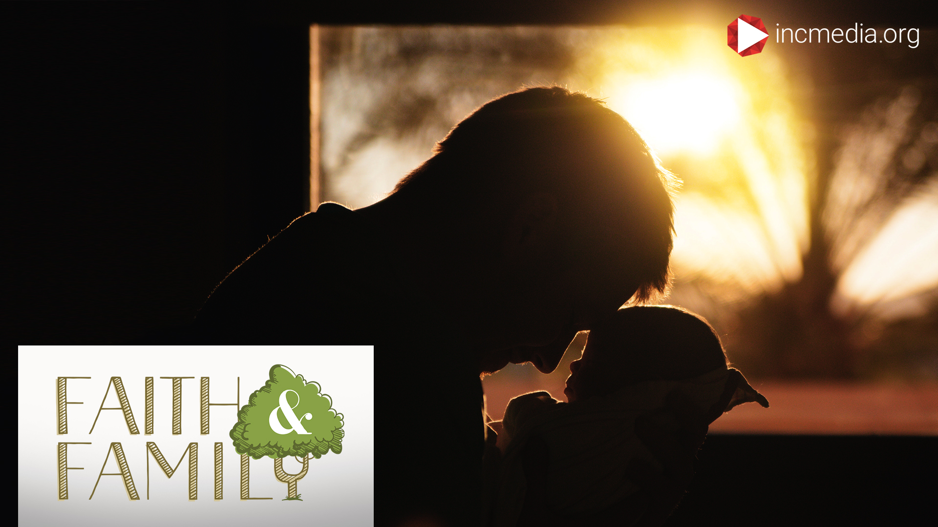 silhouette of man holding a baby