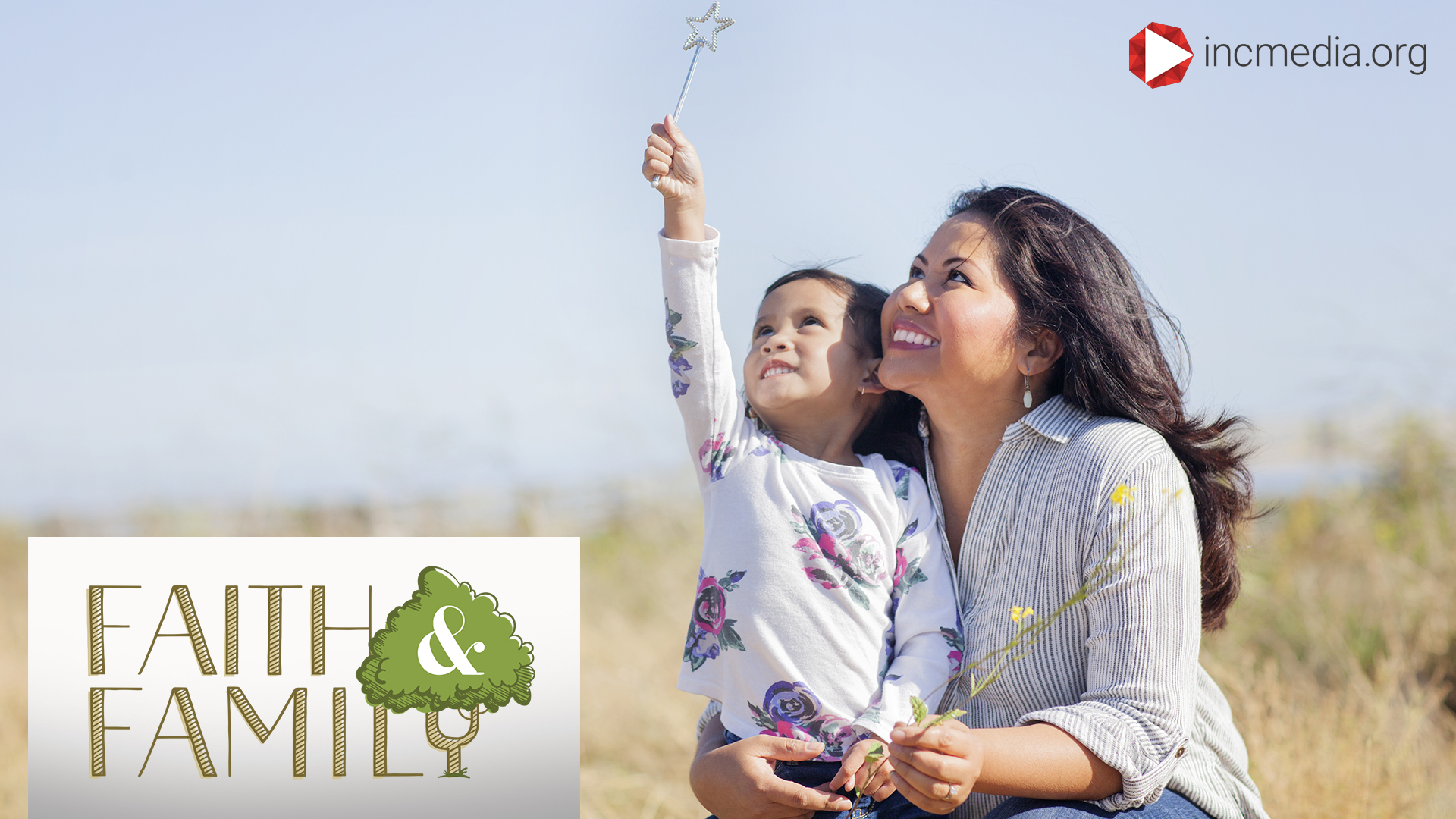 mother hugging daughter holding flowers looking up at the sky