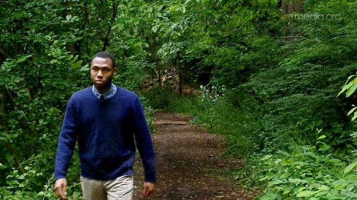 man walking in the woods