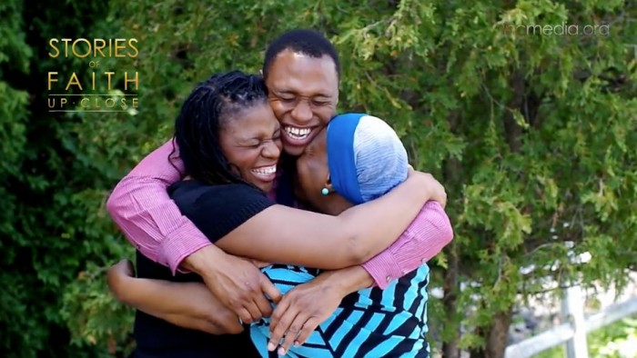 family group hug of son, daughter and mother